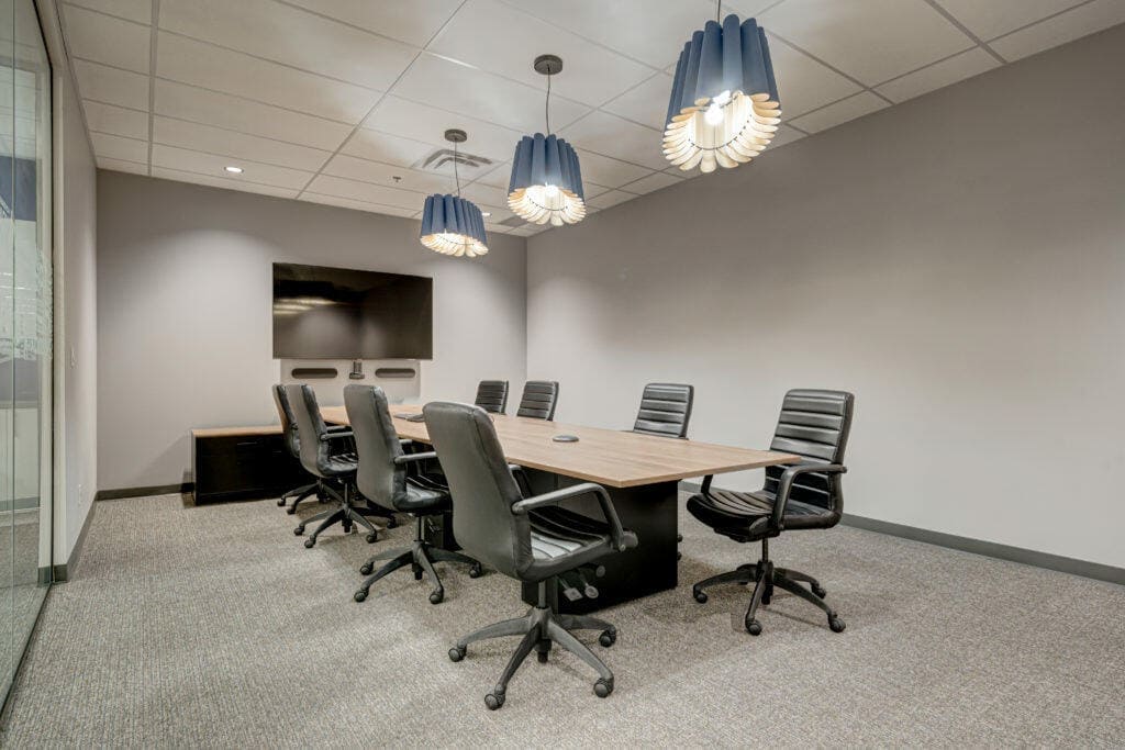 An image of a carpeted boardroom