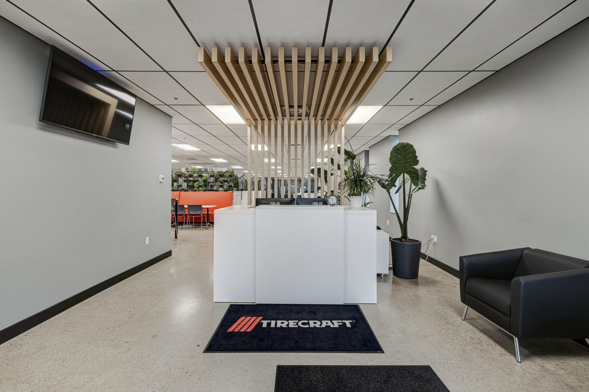 Reception area with decorative wood slats behind desk