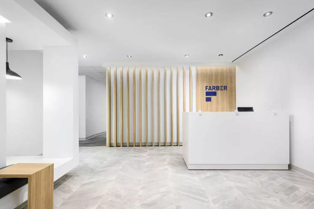 Modern business lobby with light grey herringbone floor