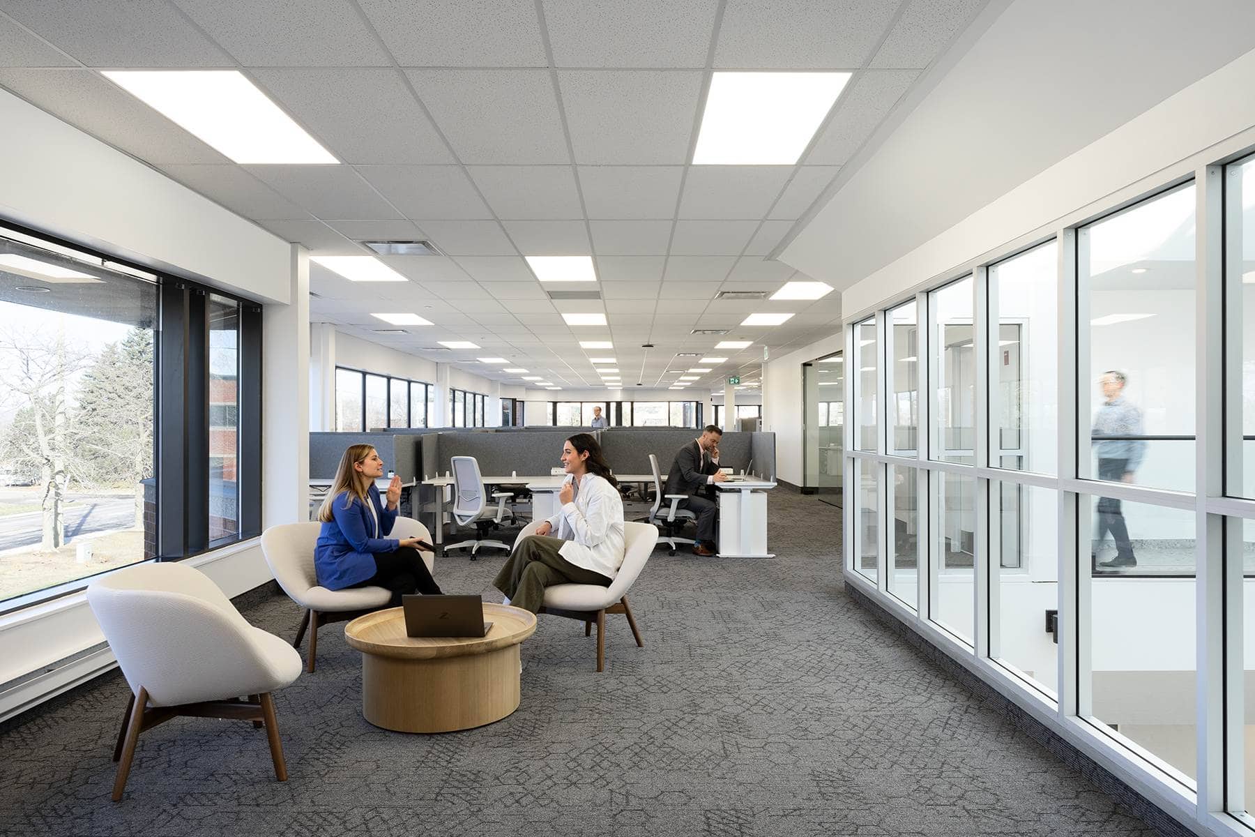 breakout space and collaborative area next to a glass wall partition