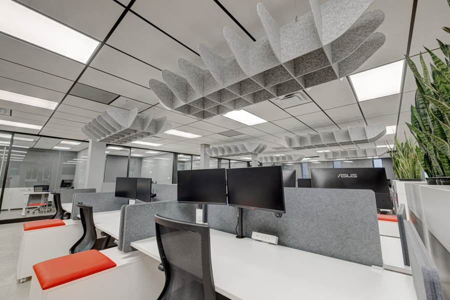 Dedicated Deskspace with wall partitions in brightly lit open space office