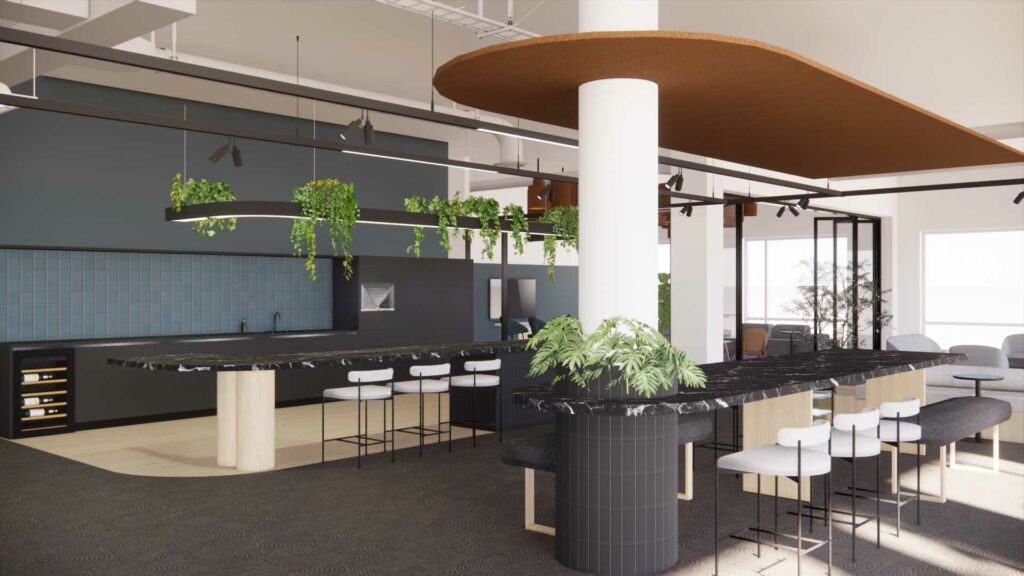 Modern office kitchen with black counters, white stools, and hanging green plants, featuring natural lighting and a minimalistic office design.