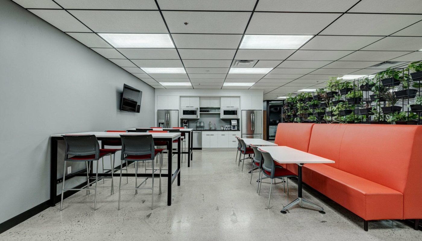 Kitchen with bar tables and booth seating